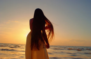 The Icon Wig - 40-42" Raw Straight Signature Wig at sunset by Luxuriant Premium
